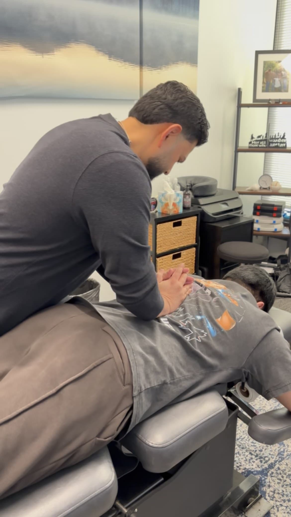 Dr. Tushar Rawalji, DC performing chiropractic adjustment at Foundation Chiropractic and Wellness